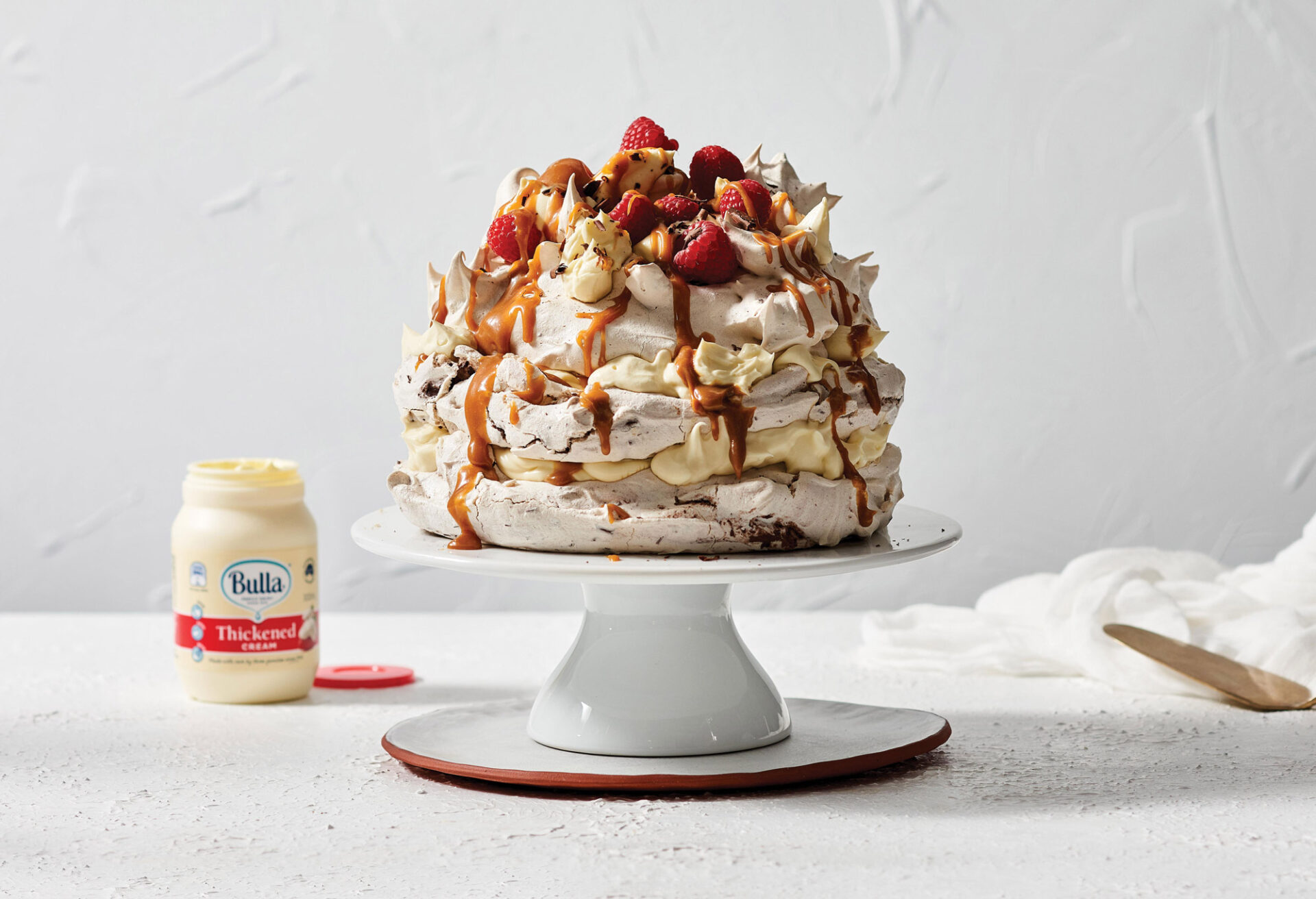 Triple Layered Chocolate Pavlova with Raspberries & Toffee Sauce Bulla